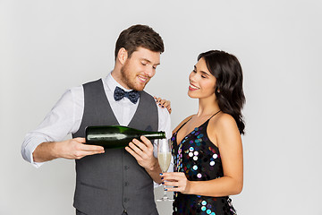 Image showing happy couple with champagne and glass at party