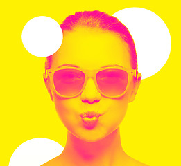 Image showing girl in pink sunglasses blowing kiss