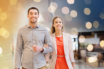 Image showing happy young couple with shopping bags in mall