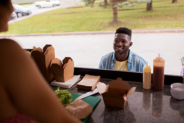 Image showing african american man ordering wok at food truck