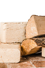 Image showing Wood briquette and firewood, close-up