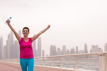 Image showing young woman celebrating a successful training run