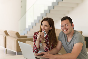 Image showing happy young couple buying online