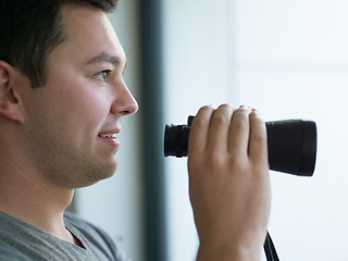 Image showing man looking with binoculars