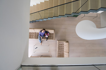 Image showing mother and her cute little daughter are using a tablet top view