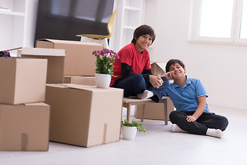 Image showing boys with cardboard boxes around them