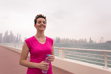 Image showing young woman celebrating a successful training run