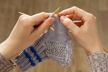 Image showing woman hands knitting a sock