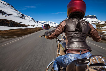 Image showing Biker girl First-person view, mountain serpentine.