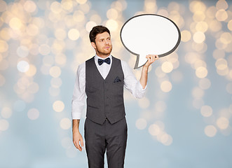 Image showing man in suit holding blank text bubble banner