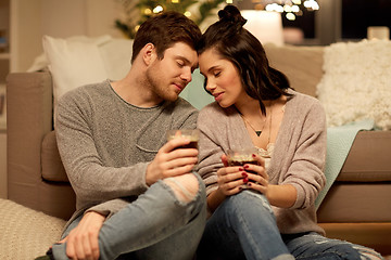 Image showing happy couple drinking coffee and eating at home