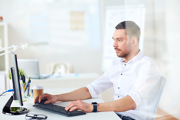 Image showing businessman typing on computer keyboard at office