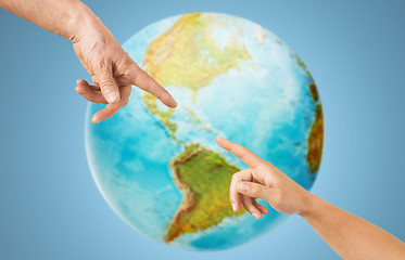 Image showing close up of senior and young woman hands