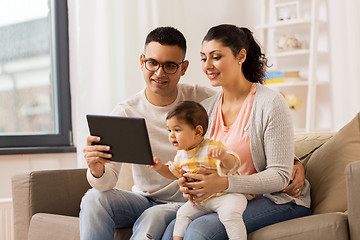 Image showing mother, father and baby with tablet pc at home