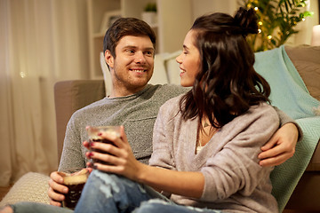 Image showing happy couple drinking coffee and eating at home