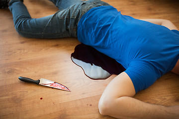 Image showing dead man body lying on floor at crime scene