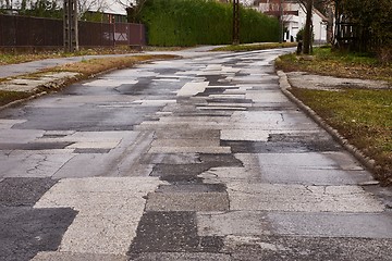 Image showing Patched broken road