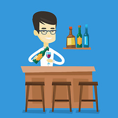 Image showing Bartender standing at the bar counter.