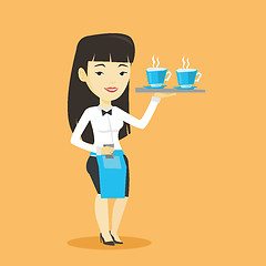 Image showing Waitress holding tray with cups of coffeee or tea.