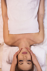 Image showing woman receiving a head massage