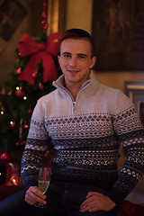 Image showing Happy young man with a glass of champagne