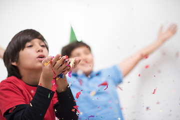 Image showing kids  blowing confetti