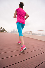 Image showing woman running on the promenade