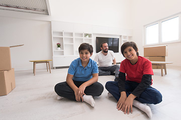 Image showing portrait of happy young boys with their dad