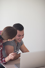 Image showing happy young couple buying online