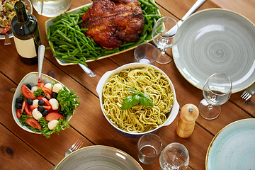 Image showing pasta, vegetable salad and other food on table