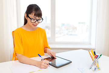 Image showing asian student girl with tablet pc learning at home