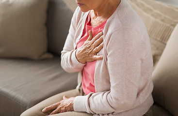 Image showing close up of senior woman having heartache at home