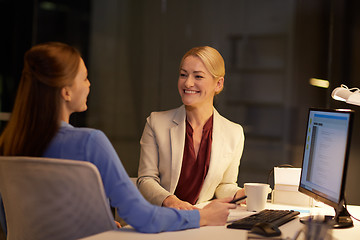Image showing businesswomen talking late at night office