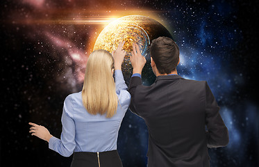 Image showing businessman and businesswoman over space