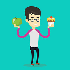 Image showing Man choosing between apple and cupcake.