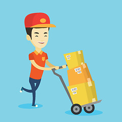 Image showing Delivery postman with cardboard boxes on trolley.