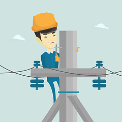 Image showing Electrician working on electric power pole.