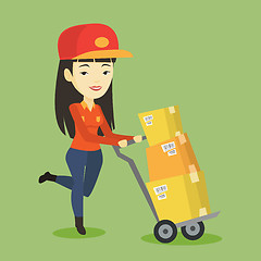 Image showing Delivery postman with cardboard boxes on trolley.