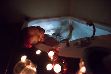 Image showing man relaxing in the jacuzzi