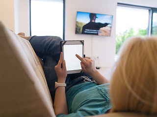 Image showing woman on sofa using tablet computer