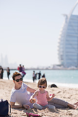 Image showing Mom and daughter on the beach