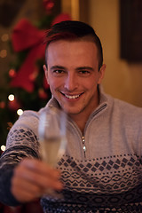 Image showing Happy young man with a glass of champagne