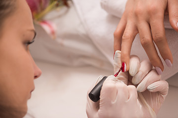 Image showing Woman hands receiving a manicure