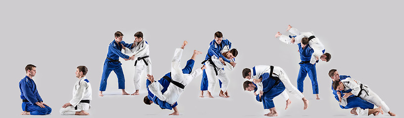 Image showing The two judokas fighters fighting men