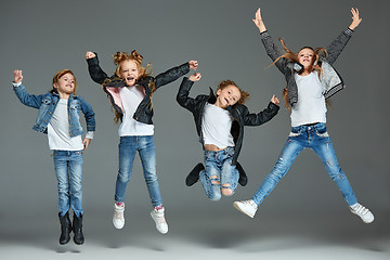 Image showing Young girl jumping at studio