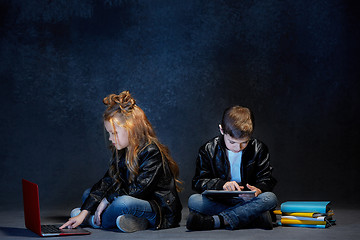 Image showing Studio shot of two children with laptop