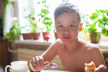 Image showing Cute boy ready for breakfast