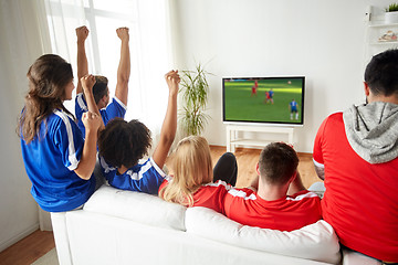 Image showing football fans watching soccer game on tv at home