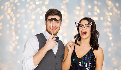 Image showing happy couple with party props having fun