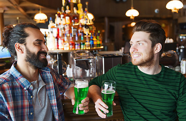 Image showing male friends drinking green beer at bar or pub